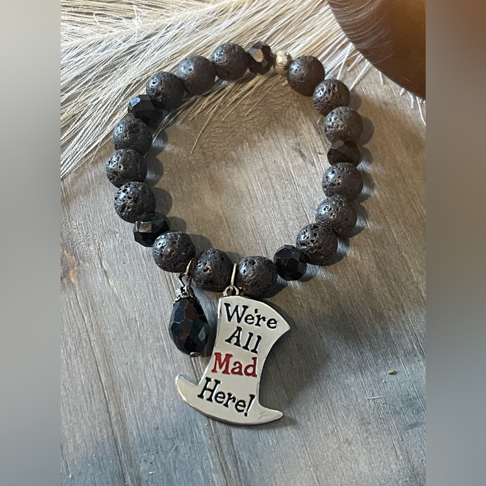 Lava rock bracelet with were all mad here charm